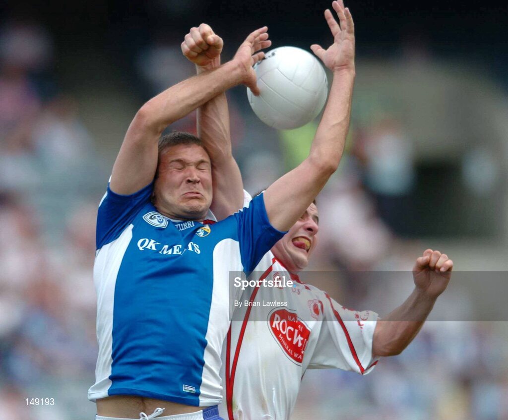 1 August 2004; Shane Cooke, Laois, in action against Michael McGee, Tyrone. Bank of Ireland All-Ireland Football Championship, Round 4, Laois v Tyrone, Croke Park, Dublin. Picture credit; Brian Lawless / SPORTSFILE