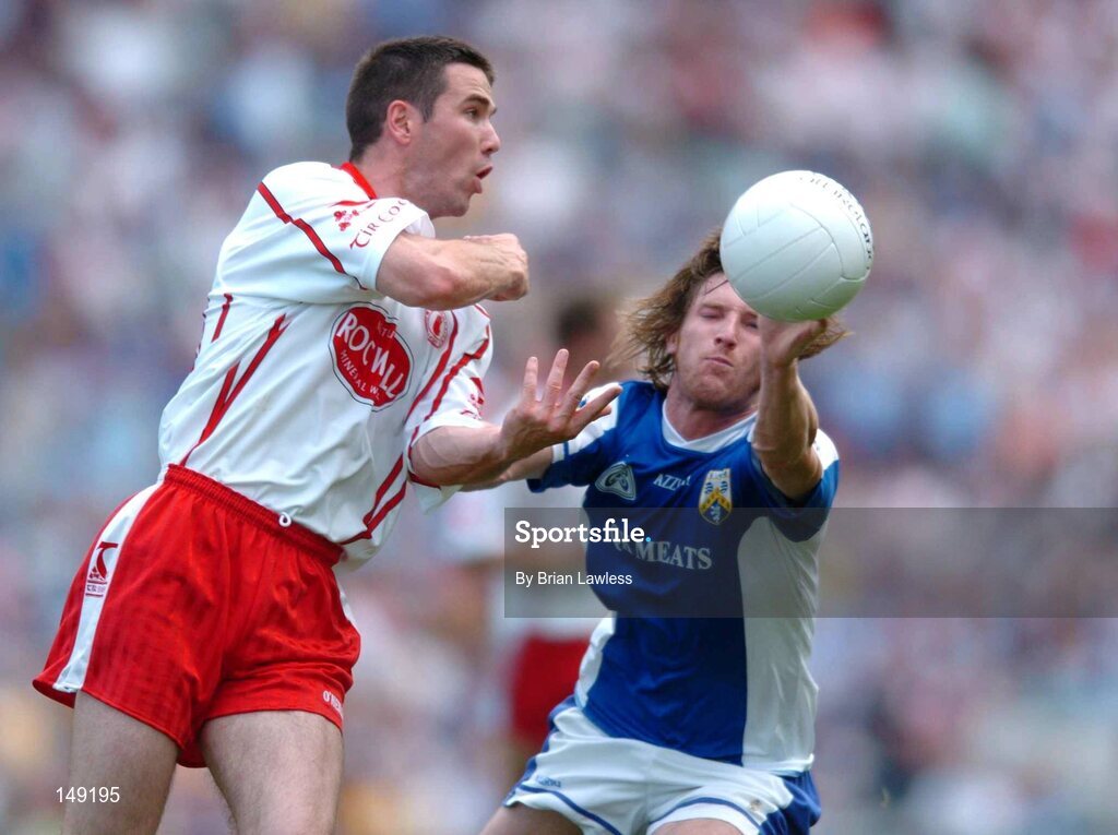1 August 2004; Ciaran Gourley, Tyrone, in action against Colm Parkinson, Laois. Bank of Ireland All-Ireland Football Championship, Round 4, Laois v Tyrone, Croke Park, Dublin. Picture credit; Brian Lawless / SPORTSFILE