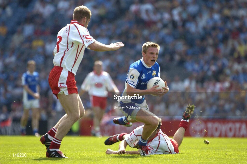 1 August 2004; Ross Munnelly, Laois, in action against, Brian Dooher, and Kevin Hughes, left, Tyrone. Bank of Ireland All-Ireland Football Championship, Round 4, Laois v Tyrone, Croke Park, Dublin. Picture credit; Ray McManus / SPORTSFILE