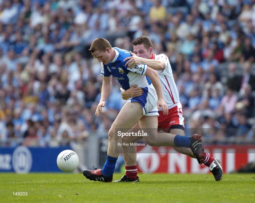 1 August 2004; Paul Lawlor, Laois, in action against Michael McGee, Tyrone. Bank of Ireland All-Ireland Football Championship, Round 4, Laois v Tyrone, Croke Park, Dublin. Picture credit; Ray McManus / SPORTSFILE