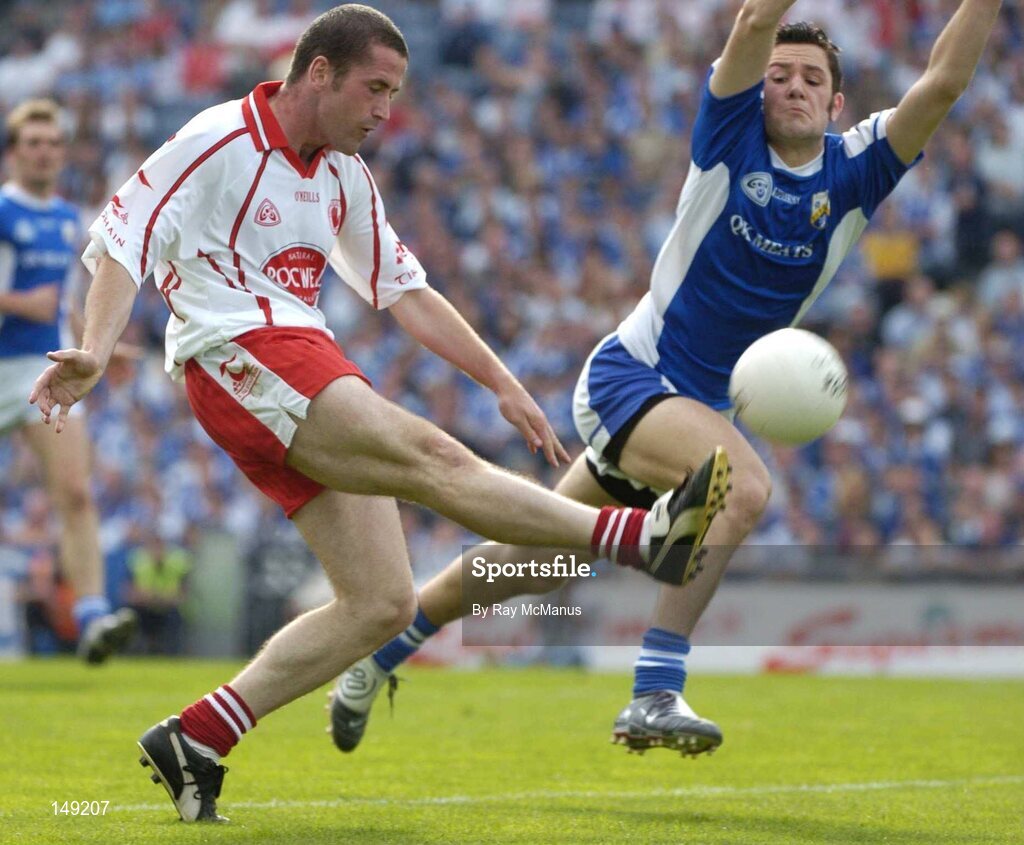 1 August 2004; Stephen O'Neill,Tyrone, in action against Cathal Ryan, Tyrone. Bank of Ireland All-Ireland Football ChampiCathal onship, Round 4, Laois v Tyrone, Croke Park, Dublin. Picture credit; Ray McManus / SPORTSFILE