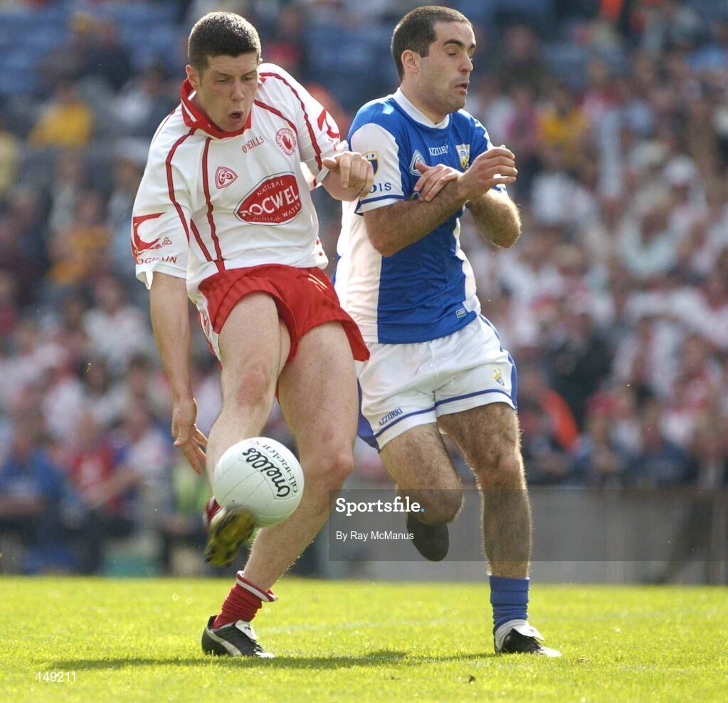 1 August 2004; Sean Cavanagh, Tyrone, in action against Aidan Fennelly, Tyrone. Bank of Ireland All-Ireland Football Championship, Round 4, Laois v Tyrone, Croke Park, Dublin. Picture credit; Ray McManus / SPORTSFILE