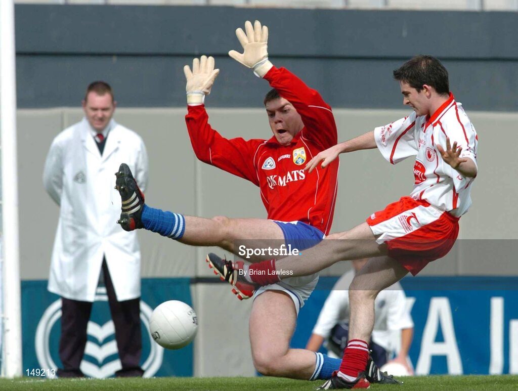 1 August 2004; Mark Harte, Tyrone, shoots to score his sides third goal despite the efforts of Laois goalkeeper Fergal Byron. Bank of Ireland All-Ireland Football Championship, Round 4, Laois v Tyrone, Croke Park, Dublin. Picture credit; Brian Lawless / SPORTSFILE
