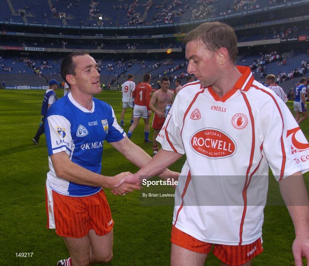 1 August 2004; Tyrone captain Brian Dooher, left, shakes team-mate Gerard Cavlan's hand after the game. Bank of Ireland All-Ireland Football Championship, Round 4, Laois v Tyrone, Croke Park, Dublin. Picture credit; Brian Lawless / SPORTSFILE