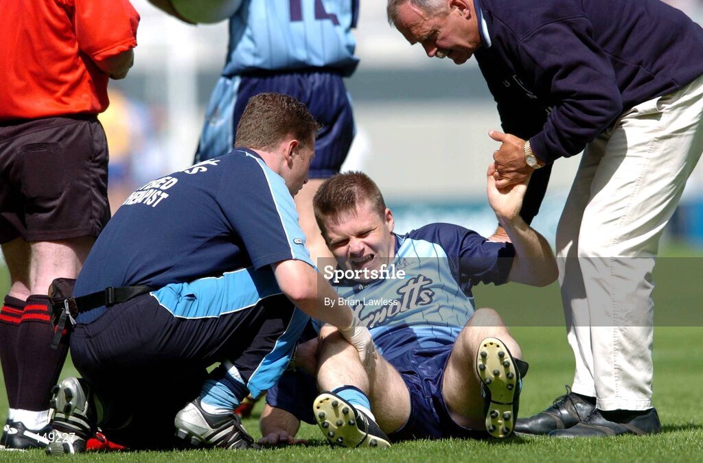 1 August 2004; Dublin's Dessie Farrell is attended to by the team doctor, right, and physiotherapist. Bank of Ireland All-Ireland Football Championship, Round 4, Dublin v Roscommon, Croke Park, Dublin. Picture credit; Brian Lawless / SPORTSFILE