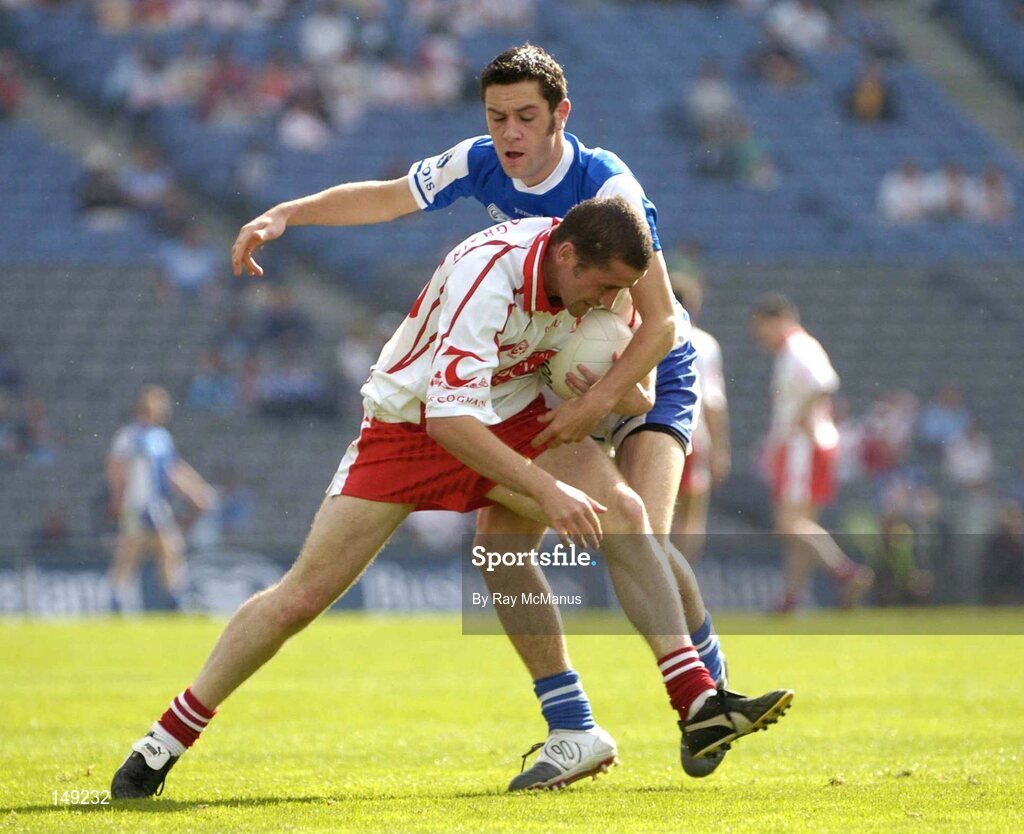 1 August 2004; Stephen O'Neill, Tyrone, in action against Cathal Ryan, Tyrone. Bank of Ireland All-Ireland Football ChampiCathal onship, Round 4, Laois v Tyrone, Croke Park, Dublin. Picture credit; Ray McManus / SPORTSFILE