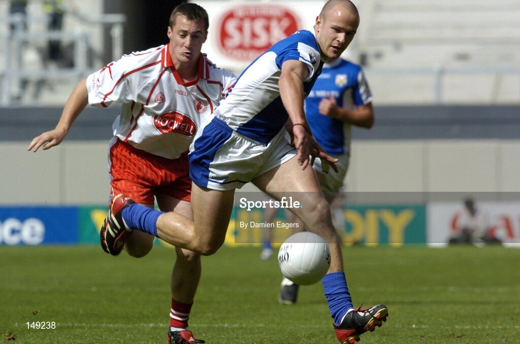 1 August 2004; Tom Kelly, Laois, in action against Brian McGuigan, Tyrone. Bank of Ireland All-Ireland Football Championship, Round 4, Laois v Tyrone, Croke Park, Dublin. Picture credit; Damien Eagers / SPORTSFILE