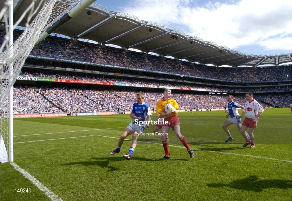 1 August 2004; Ross Munnelly, Laois, challenges Tyrone goalkeeper Pascal McConnell, as Laois's Shane Cooke and Tyrone's Conor Gormley await the outcome. Bank of Ireland All-Ireland Football Championship, Round 4, Laois v Tyrone, Croke Park, Dublin. Picture credit; Damien Eagers / SPORTSFILE