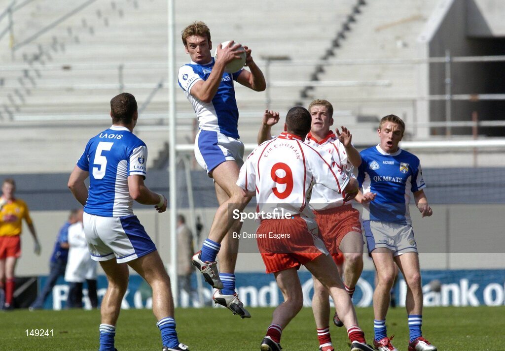1 August 2004; Noel Garvan, Laois, gathers a high ball ahead of Tyrone's Sean Cavanagh, (9), and Kevin Hughes. Bank of Ireland All-Ireland Football Championship, Round 4, Laois v Tyrone, Croke Park, Dublin. Picture credit; Damien Eagers / SPORTSFILE
