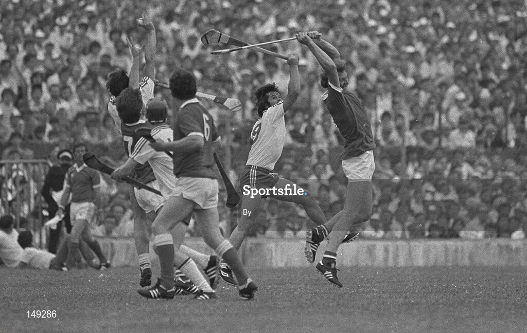 10 July 1983; Cork's Tim Crowley, with team-mates Tom Cashman, (7) and John Crowley, (6) in action against Mossy Walsh, (9) Waterford. Munster hurling Final. Cork v Waterford, Gaelic Grounds, Limerick. Picture credit; Ray McManus / SPORTSFILE