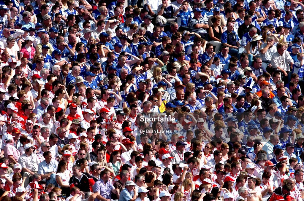 1 August 2004; Laois and Tyrone fans watch the game. Bank of Ireland All-Ireland Football Championship, Round 4, Laois v Tyrone, Croke Park, Dublin. Picture credit; Brian Lawless / SPORTSFILE