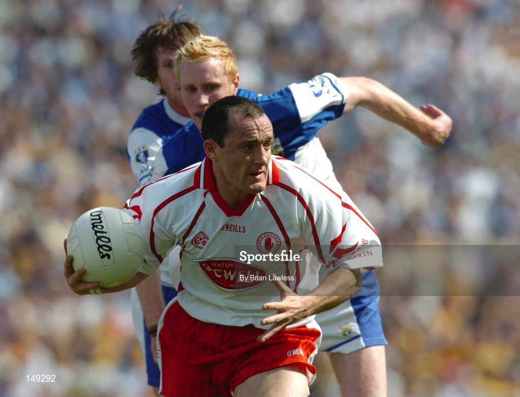1 August 2004; Brian Dooher, Tyrone, in action against Padraig Clancy, Laois. Bank of Ireland All-Ireland Football Championship, Round 4, Laois v Tyrone, Croke Park, Dublin. Picture credit; Brian Lawless / SPORTSFILE