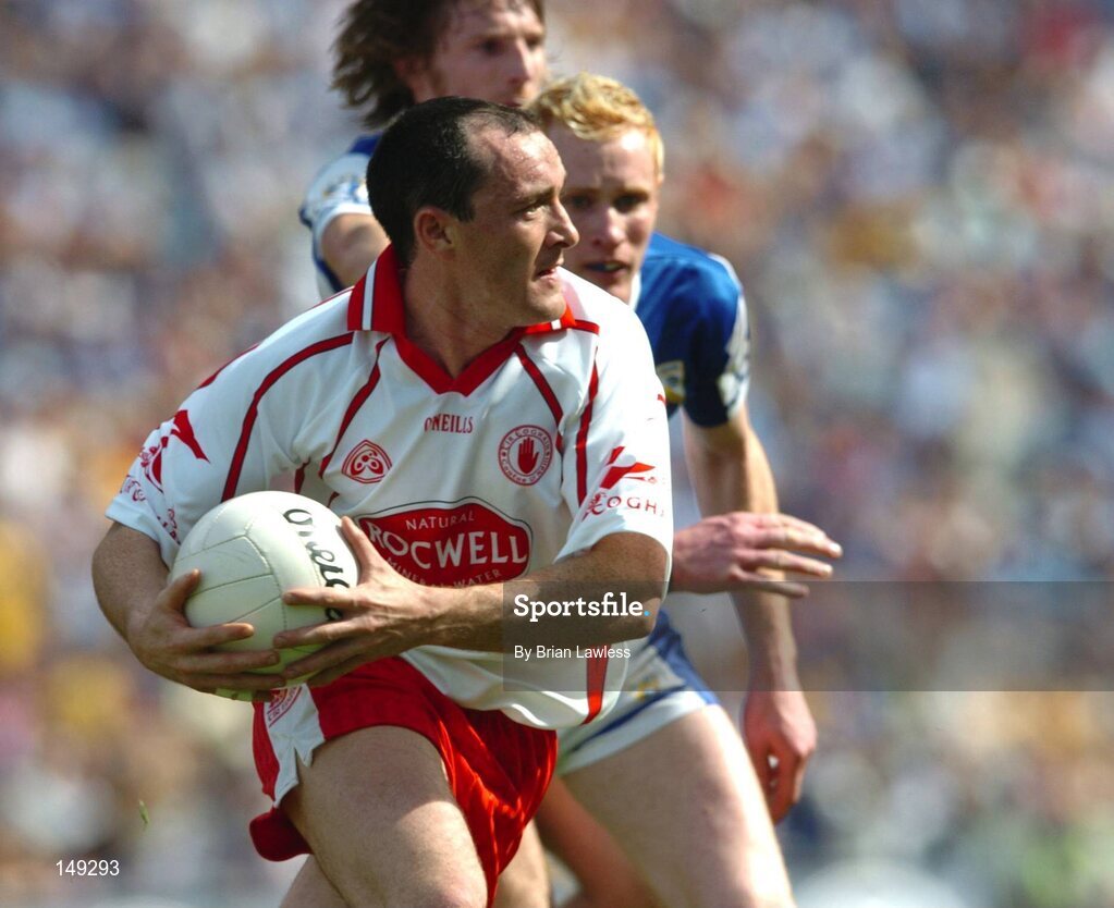 1 August 2004; Brian Dooher, Tyrone, in action against Padraig Clancy and Colm Parkinson, back, Laois. Bank of Ireland All-Ireland Football Championship, Round 4, Laois v Tyrone, Croke Park, Dublin. Picture credit; Brian Lawless / SPORTSFILE