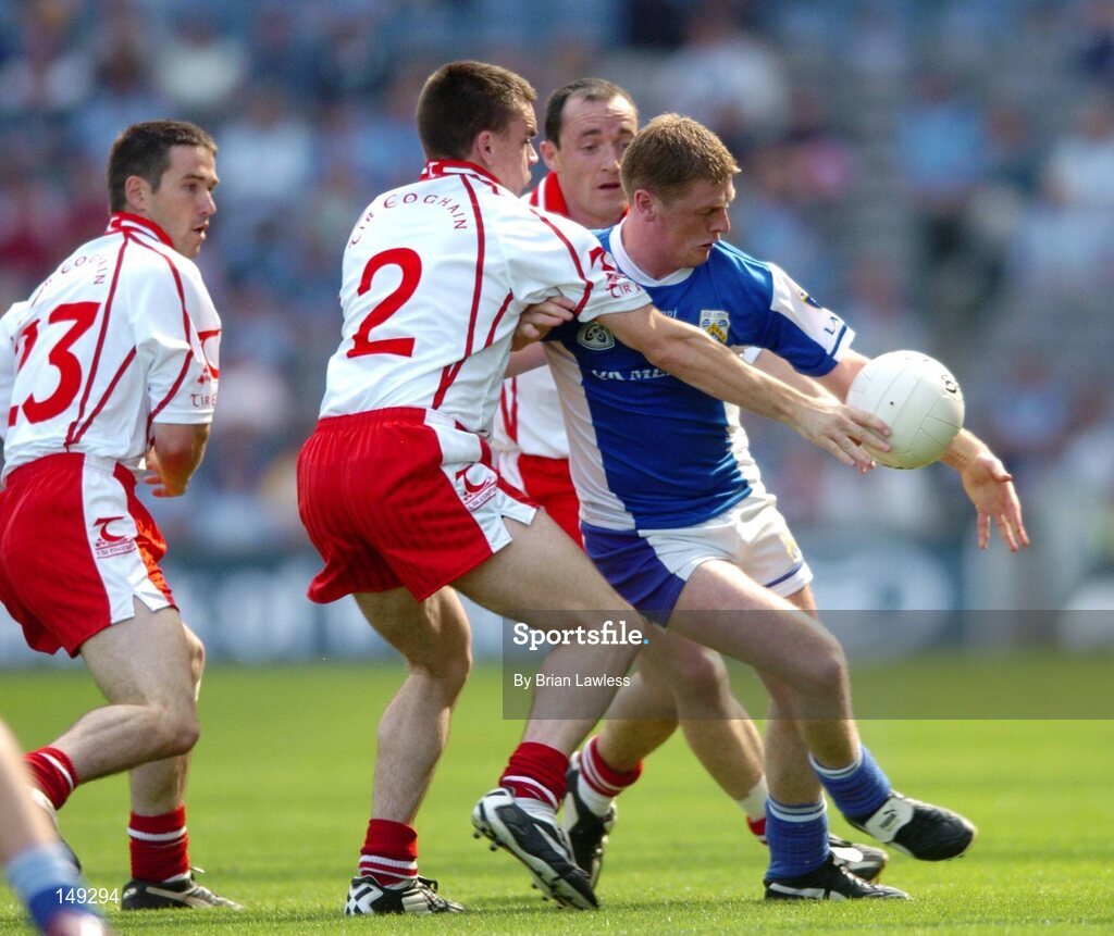 1 August 2004; Brian McDonald, Laois, in action against Tyrone's Ryan McMenamin (2), Ciaran Gourley, left, and Brian Dooher. Bank of Ireland All-Ireland Football Championship, Round 4, Laois v Tyrone, Croke Park, Dublin. Picture credit; Brian Lawless / SPORTSFILE