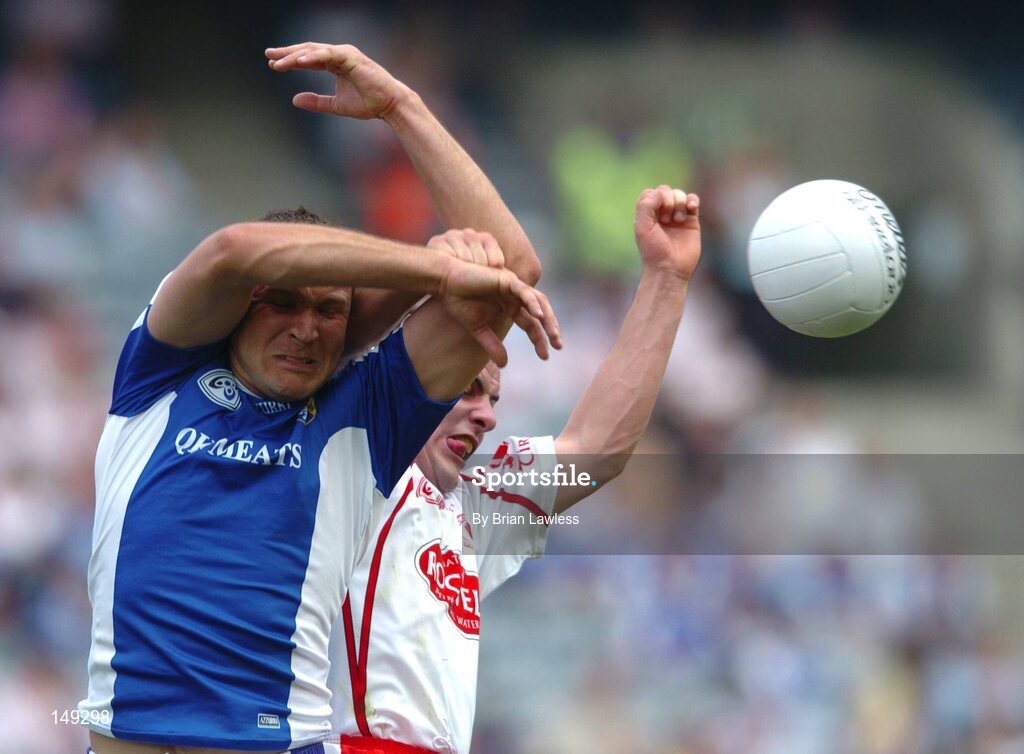 1 August 2004; Shane Cooke, Laois, in action against Michael McGee, Tyrone. Bank of Ireland All-Ireland Football Championship, Round 4, Laois v Tyrone, Croke Park, Dublin. Picture credit; Brian Lawless / SPORTSFILE
