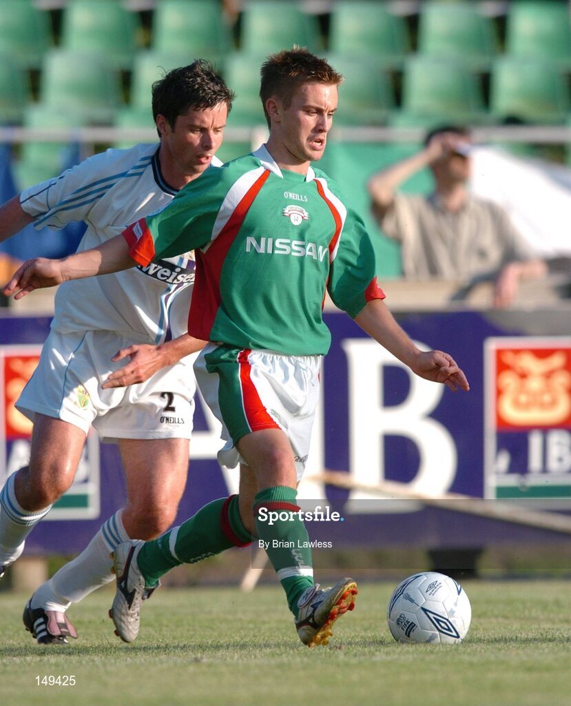 28 July 2004; Liam Kearney, Cork City, in action against Alan Mahon, UCD. FAI Cup Replay, UCD v Cork City, Belfield Park, UCD, Dublin. Picture credit; Brian Lawless / SPORTSFILE