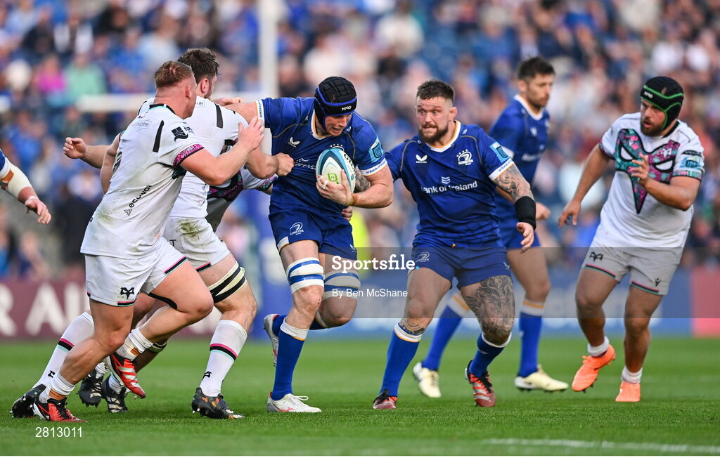 11 May 2024; Ryan Baird of Leinster is tackled by Harri Deaves of Ospreys, hidden, during the United Rugby Championship match between Leinster and Ospreys at the RDS Arena in Dublin. Photo by Ben McShane/Sportsfile
