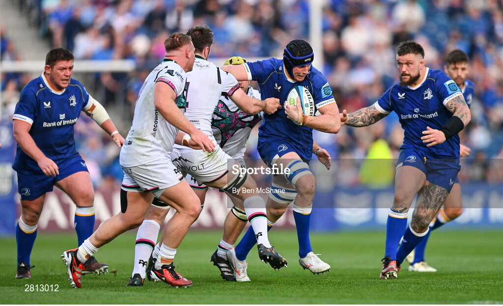 11 May 2024; Ryan Baird of Leinster is tackled by Harri Deaves of Ospreys, hidden, during the United Rugby Championship match between Leinster and Ospreys at the RDS Arena in Dublin. Photo by Ben McShane/Sportsfile