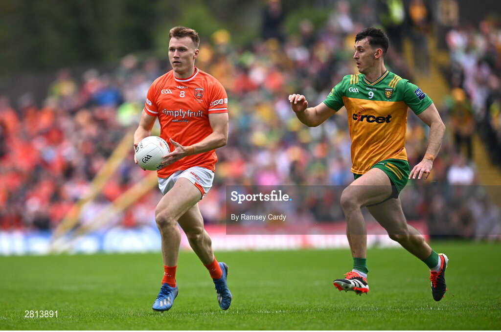12 May 2024; Rian O'Neill of Armagh in action against Michael Langan of Donegal during the Ulster GAA Football Senior Championship final match between Armagh and Donegal at St Tiernach's Park in Clones, Monaghan. Photo by Ramsey Cardy/Sportsfile