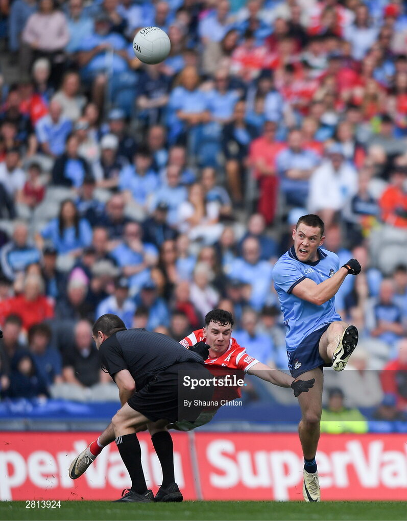 12 May 2024; Con O'Callaghan  of Dublin scores a point depsite the efforts of Craig Lennon of Louth during the Leinster GAA Football Senior Championship final match between Dublin and Louth at Croke Park in Dublin. Photo by Shauna Clinton/Sportsfile