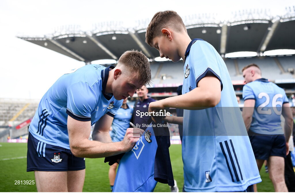 12 May 2024; Seán Bugler of Dublin signs the jersey of a supporter afterhs side's victory in the Leinster GAA Football Senior Championship final match between Dublin and Louth at Croke Park in Dublin. Photo by Shauna Clinton/Sportsfile