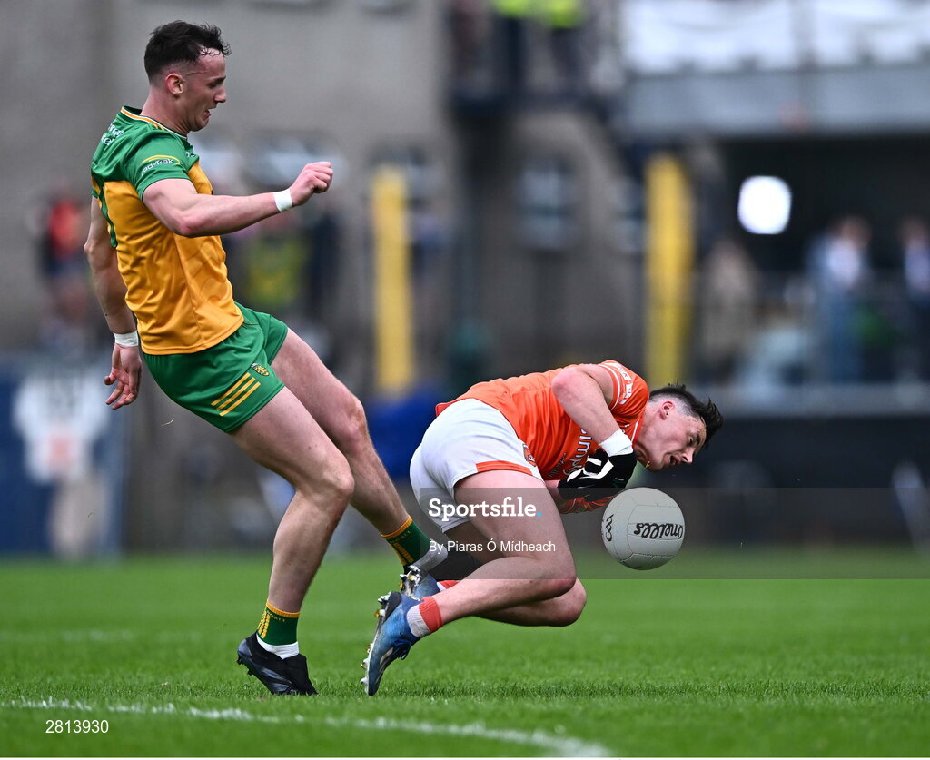 12 May 2024; Jason McGee of Donegal fouls Aaron  McKay of Armagh, for which he was shown a yellow card, during the Ulster GAA Football Senior Championship final match between Armagh and Donegal at St Tiernach's Park in Clones, Monaghan. Photo by Piaras Ó Mídheach/Sportsfile