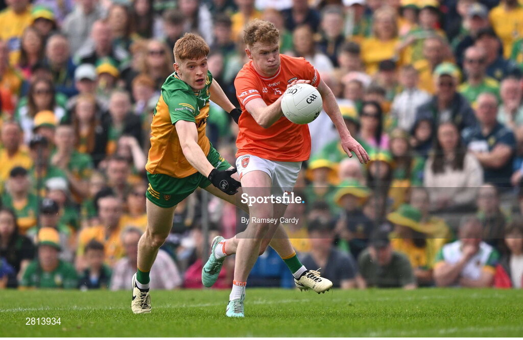 12 May 2024; Conor Turbitt of Armagh in action against Ciaran Moore of Donegal during the Ulster GAA Football Senior Championship final match between Armagh and Donegal at St Tiernach's Park in Clones, Monaghan. Photo by Ramsey Cardy/Sportsfile