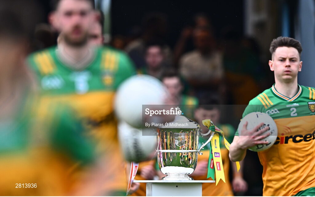12 May 2024; Donegal players run past the Anglo Celt cup before the Ulster GAA Football Senior Championship final match between Armagh and Donegal at St Tiernach's Park in Clones, Monaghan. Photo by Piaras Ó Mídheach/Sportsfile