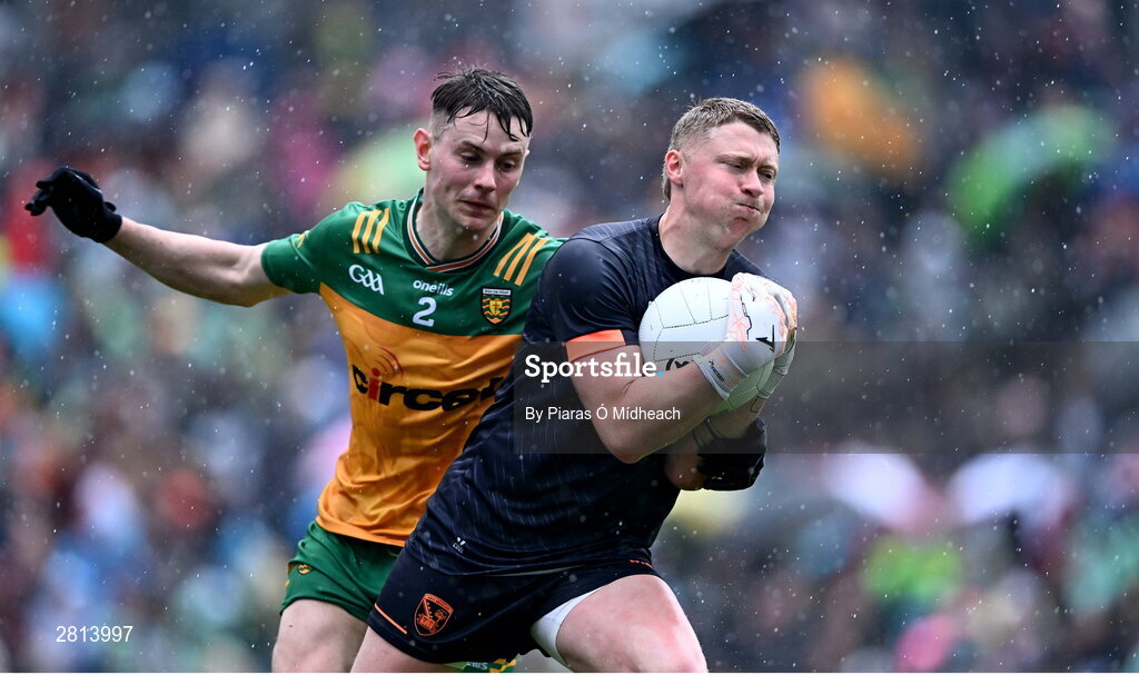 12 May 2024; Armagh goalkeeper Blaine Hughes in action against Mark Curran of Donegal during the Ulster GAA Football Senior Championship final match between Armagh and Donegal at St Tiernach's Park in Clones, Monaghan. Photo by Piaras Ó Mídheach/Sportsfile