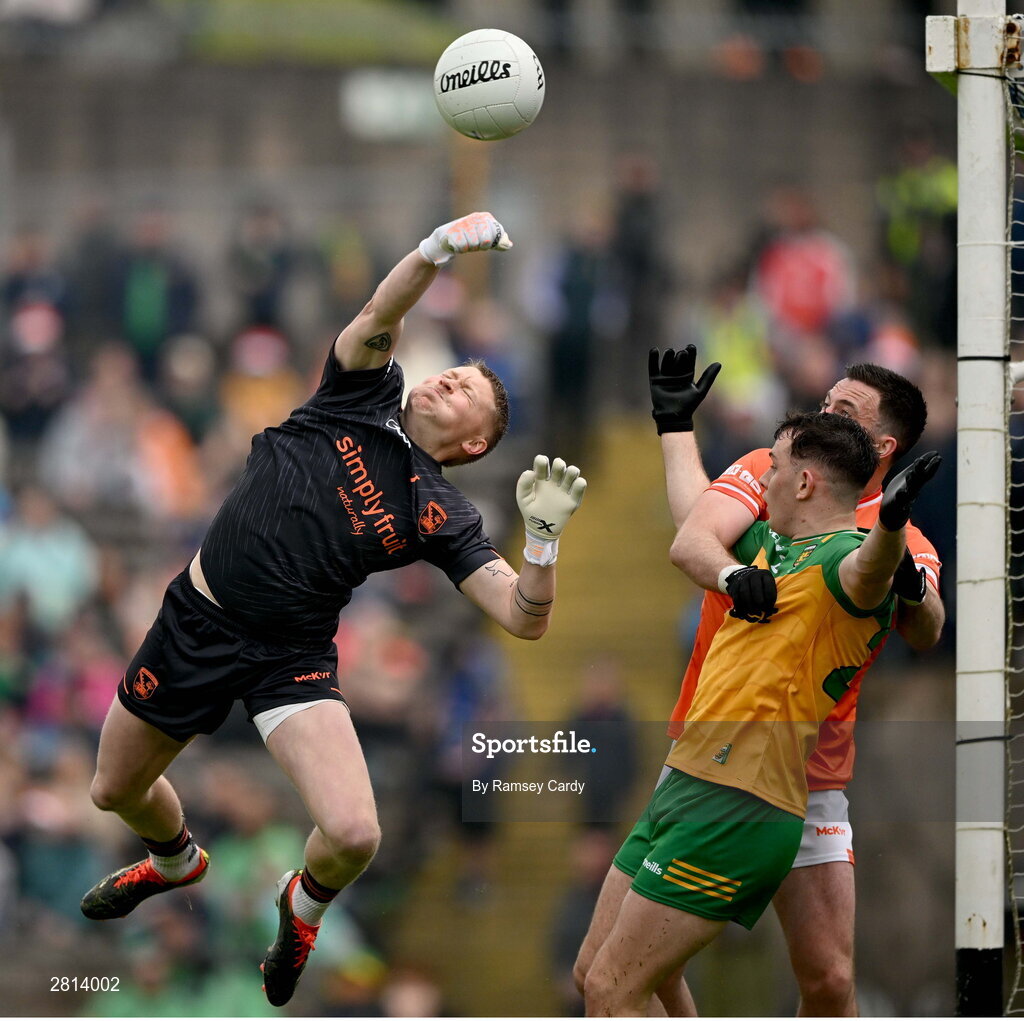 12 May 2024; Armagh goalkeeper Blaine Hughes clears under pressure from Caolan McColgan of Donegal during the Ulster GAA Football Senior Championship final match between Armagh and Donegal at St Tiernach's Park in Clones, Monaghan. Photo by Ramsey Cardy/Sportsfile