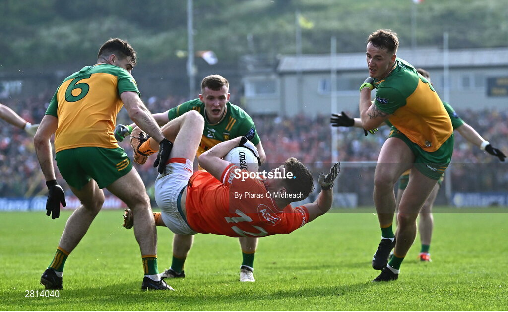 12 May 2024; Jarly Óg Burns of Armagh in action against Donegal players, from left, Caolan McGonagle, Jeaic MacCeallbhuí and Jason McGee during the Ulster GAA Football Senior Championship final match between Armagh and Donegal at St Tiernach's Park in Clones, Monaghan. Photo by Piaras Ó Mídheach/Sportsfile