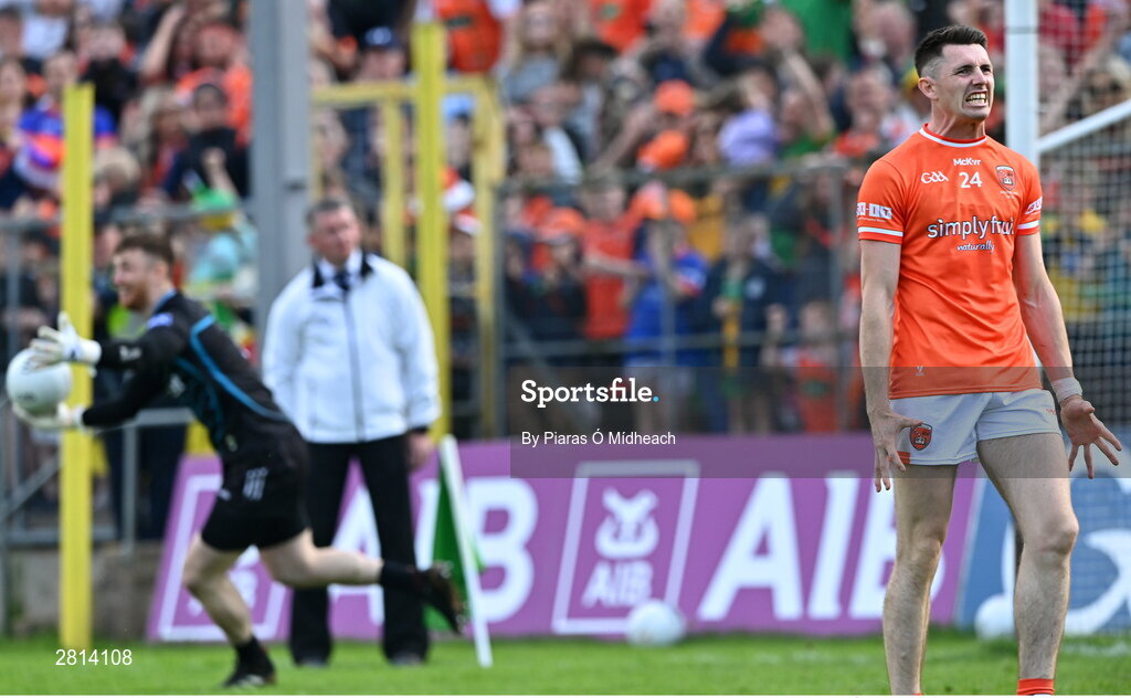 12 May 2024; Shane McPartlan of Armagh reacts after his penalty was saved by Donegal goalkeeper Shaun Patton, behind, for the last penalty in the penalty shoot-out of the Ulster GAA Football Senior Championship final match between Armagh and Donegal at St Tiernach's Park in Clones, Monaghan. Photo by Piaras Ó Mídheach/Sportsfile
