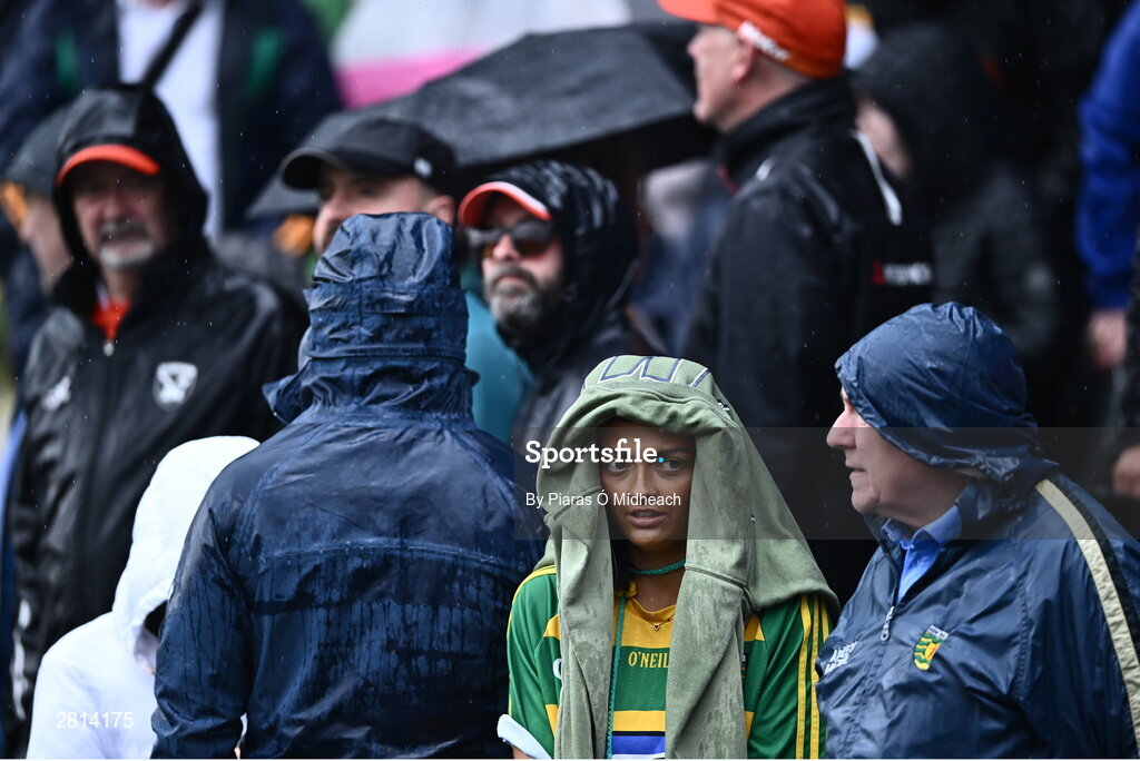 12 May 2024; Spectators during a rain shower in the Ulster GAA Football Senior Championship final match between Armagh and Donegal at St Tiernach's Park in Clones, Monaghan. Photo by Piaras Ó Mídheach/Sportsfile