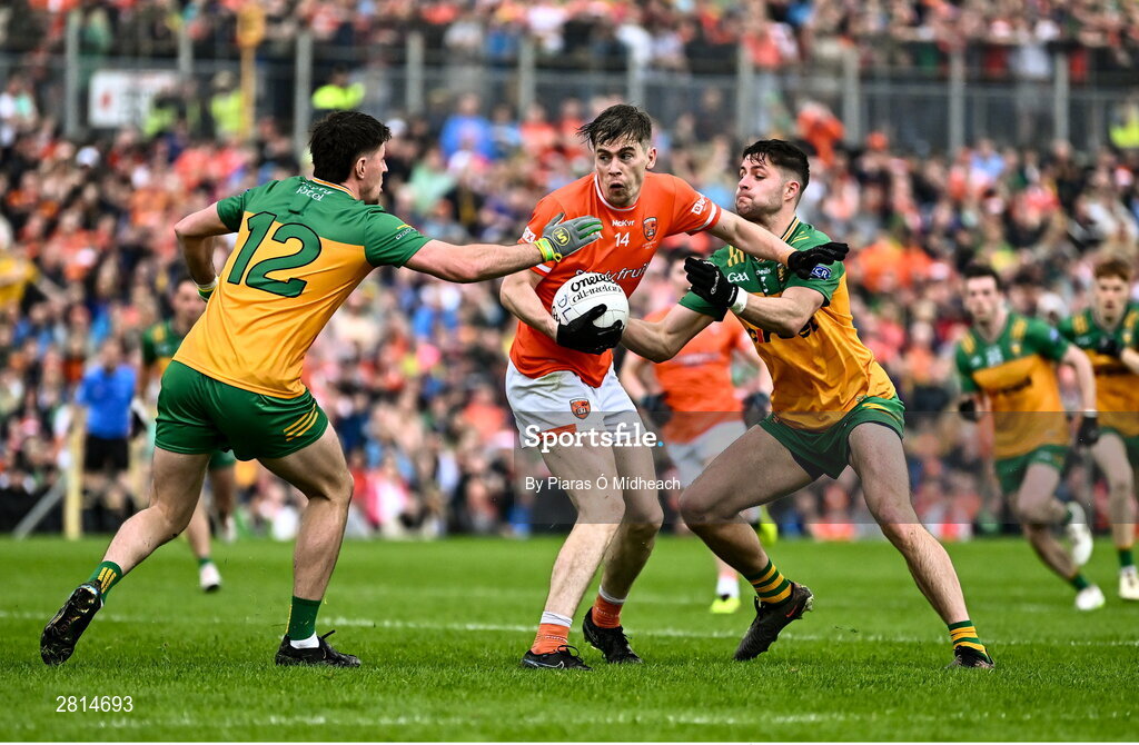12 May 2024; Andrew Murnin of Armagh in action against Daire O Baoill of Donegal, 12, and Brendan McCole of Donegal during the Ulster GAA Football Senior Championship final match between Armagh and Donegal at St Tiernach's Park in Clones, Monaghan. Photo by Piaras Ó Mídheach/Sportsfile