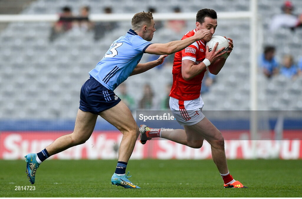 12 May 2024; Tommy Durnin of Louth is tackled by Paul Mannion of Dublin during the Leinster GAA Football Senior Championship final match between Dublin and Louth at Croke Park in Dublin. Photo by Shauna Clinton/Sportsfile