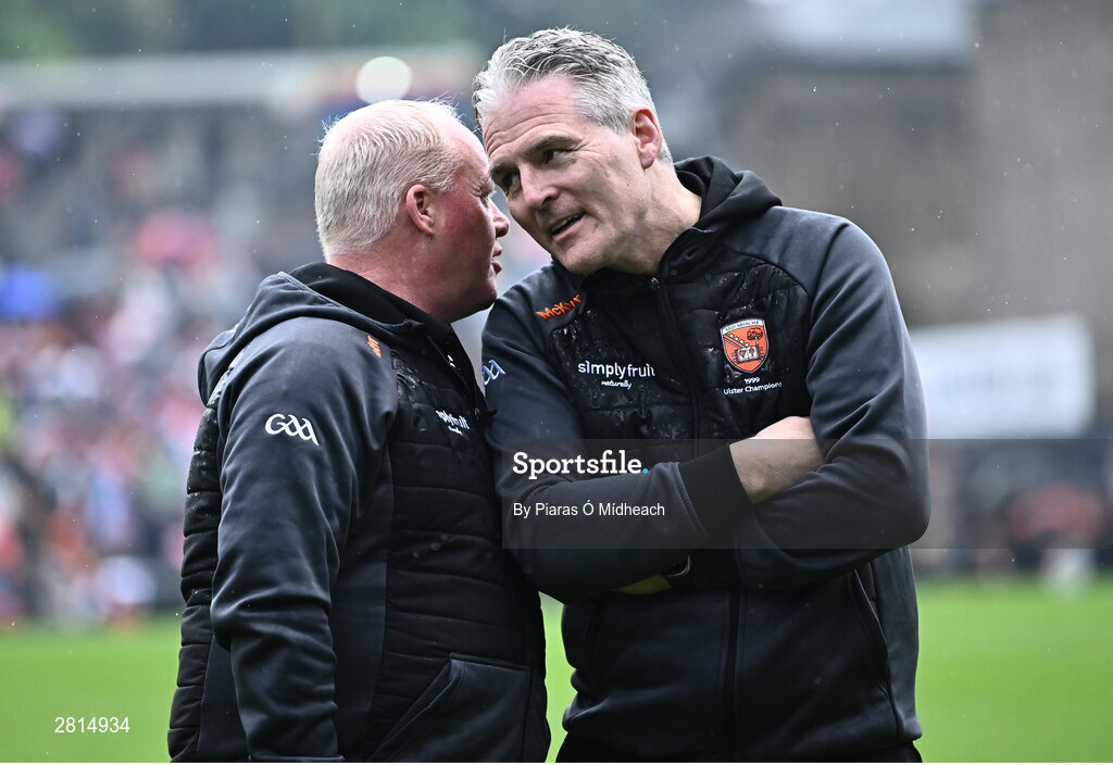 12 May 2024; Uachtarán Chumann Lúthchleas Gael Jarlath Burns with Benny Tierney, left, on the pitch as their Armagh 1999 Ulster Football Senior Championship winning team were honoured at half-time in the Ulster GAA Football Senior Championship final match between Armagh and Donegal at St Tiernach's Park in Clones, Monaghan. Photo by Piaras Ó Mídheach/Sportsfile