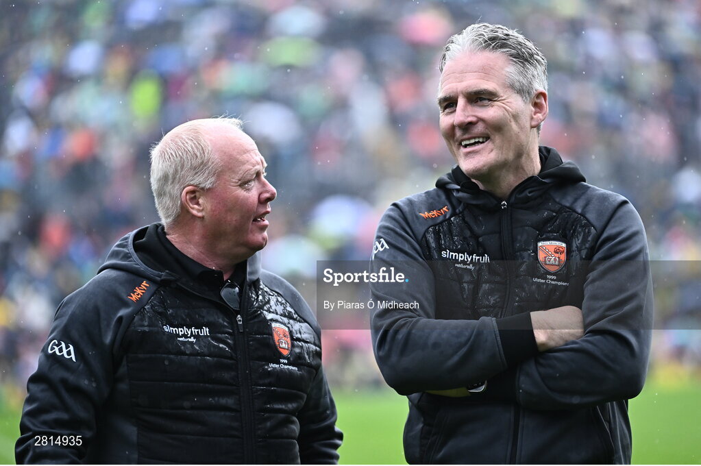 12 May 2024; Uachtarán Chumann Lúthchleas Gael Jarlath Burns with Benny Tierney, left, on the pitch as their Armagh 1999 Ulster Football Senior Championship winning team were honoured at half-time in the Ulster GAA Football Senior Championship final match between Armagh and Donegal at St Tiernach's Park in Clones, Monaghan. Photo by Piaras Ó Mídheach/Sportsfile