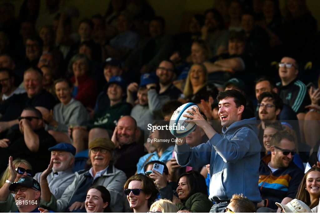 11 May 2024; A supporter catches the match ball during the United Rugby Championship match between Leinster and Ospreys at the RDS Arena in Dublin. Photo by Ramsey Cardy/Sportsfile
