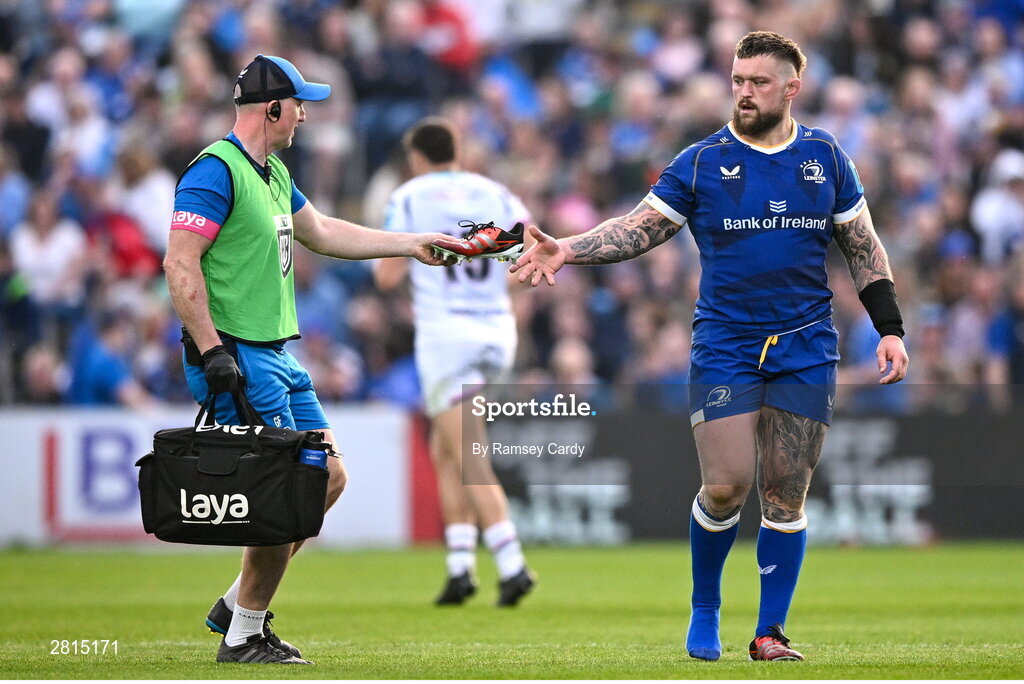 11 May 2024; Andrew Porter of Leinster is handed his boot by Leinster head physiotherapist Garreth Farrell during the United Rugby Championship match between Leinster and Ospreys at the RDS Arena in Dublin. Photo by Ramsey Cardy/Sportsfile