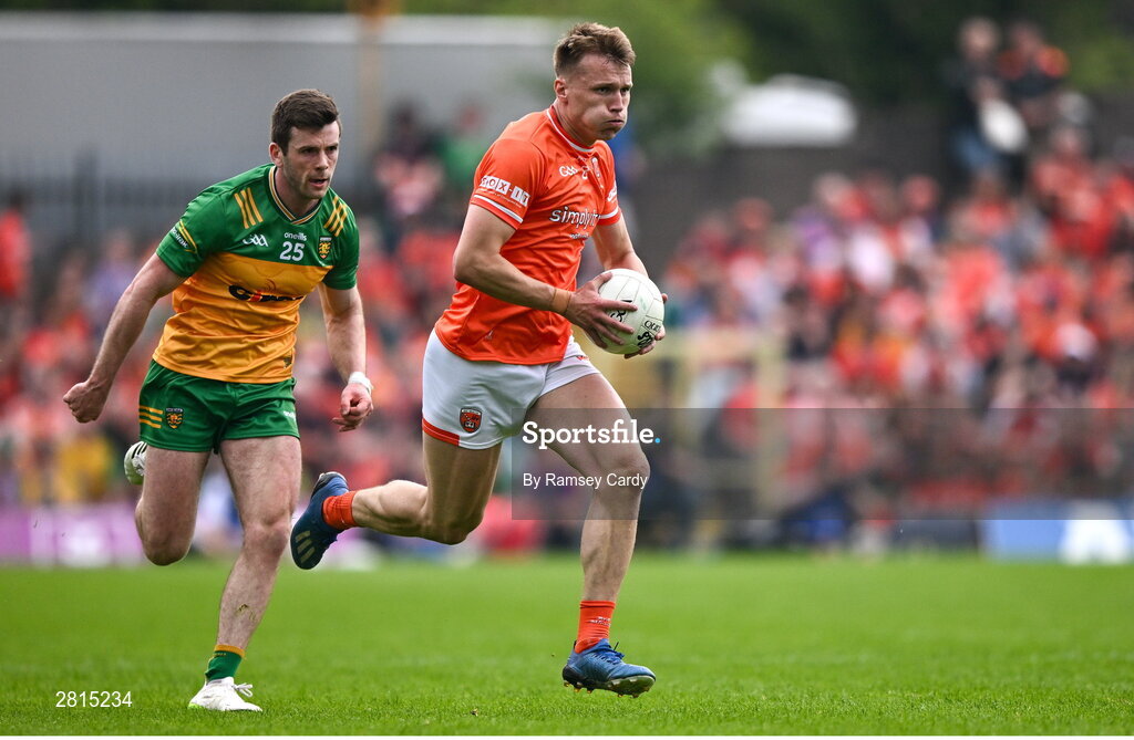 12 May 2024; Rian O'Neill of Armagh in action against Eoghán Bán Gallagher of Donegal during the Ulster GAA Football Senior Championship final match between Armagh and Donegal at St Tiernach's Park in Clones, Monaghan. Photo by Ramsey Cardy/Sportsfile