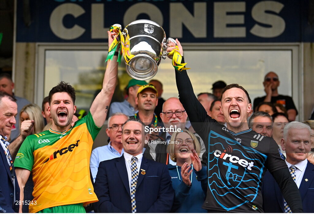 12 May 2024; Donegal's Brendan McCole, left, and Gavin Mulreany lifts the Anglo Celt Cup after the Ulster GAA Football Senior Championship final match between Armagh and Donegal at St Tiernach's Park in Clones, Monaghan. Photo by Ramsey Cardy/Sportsfile