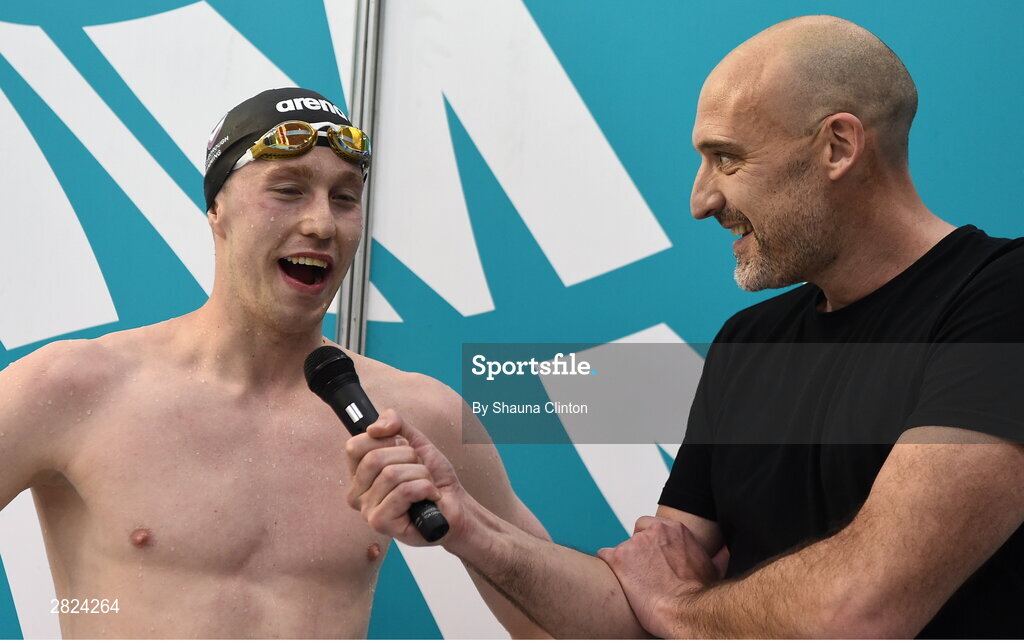 23 May 2024; Nathan Wiffen of Larne Swimming Club is interviewed by Andrew Bree after winning the Men's 800m Freestyle Finals during day two of the Ireland Olympic Swimming Trials at the National Aquatic Centre on the Sport Ireland Campus in Dublin. Photo by Shauna Clinton/Sportsfile