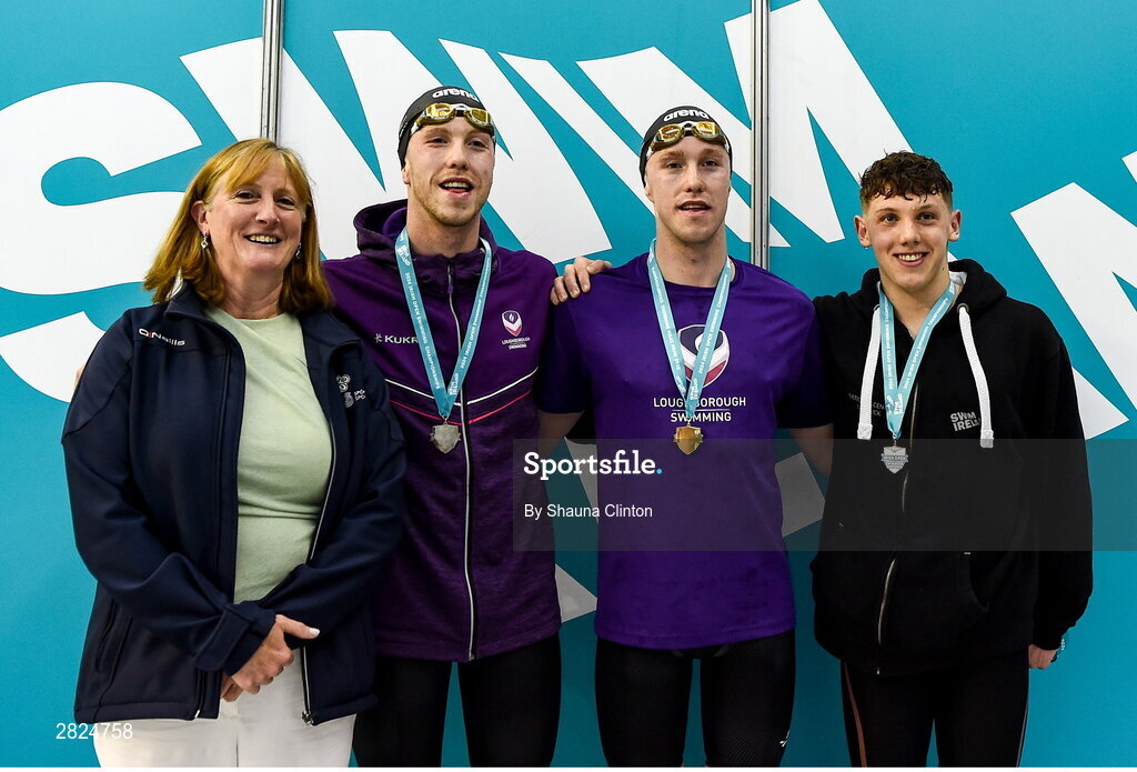 23 May 2024; Nathan Wiffen of Larne Swimming club, who won gold, with Daniel Wiffen of Larne Swimming Club, left, who won silver, left, and Dennis O'Brien of Limerick, right, who won bronze, after competing the Men's 800m Freestyle Finals with Dr Úna May, CEO Sport Ireland, left, during day two of the Ireland Olympic Swimming Trials at the National Aquatic Centre on the Sport Ireland Campus in Dublin. Photo by Shauna Clinton/Sportsfile