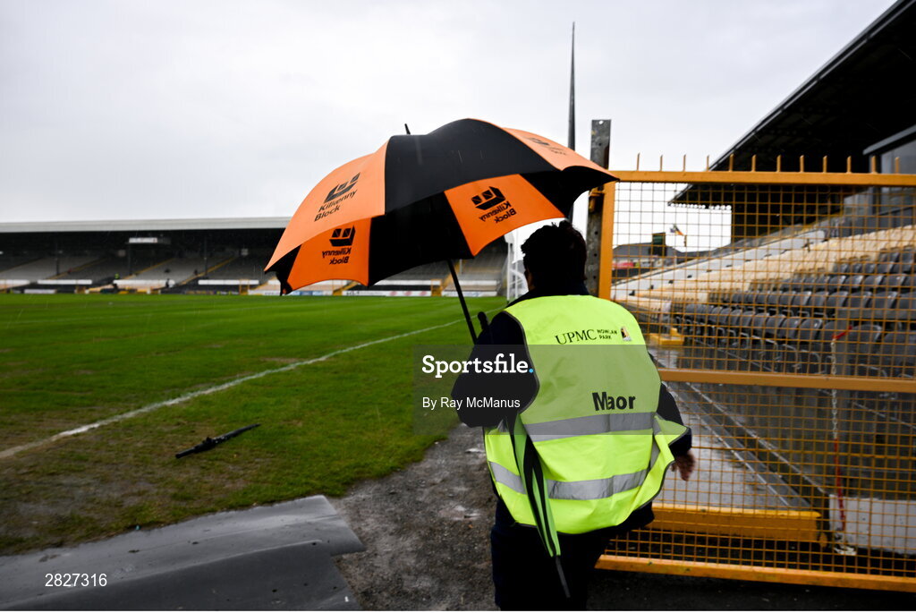 26 May 2024; A 'Maor' heads to her post in driving rain before  the Leinster GAA Hurling Senior Championship Round 5 match between Kilkenny and Wexford at UPMC Nowlan Park in Kilkenny. Photo by Ray McManus/Sportsfile