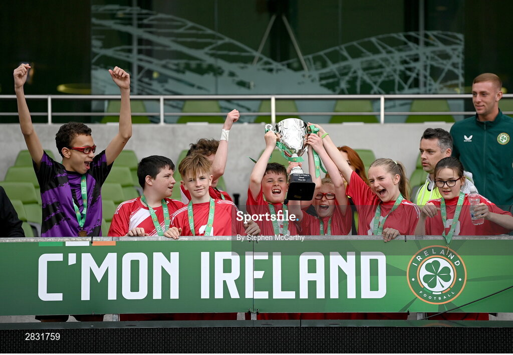 29 May 2024; Catherine McAuley School, Limerick, players celebrate after winning the Football For All cup during the FAI Primary 5s Finals day at Aviva Stadium in Dublin. Photo by Stephen McCarthy/Sportsfile