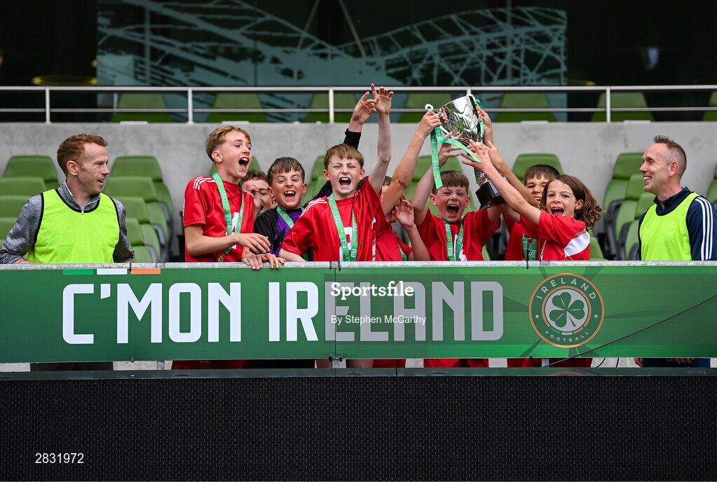 29 May 2024; Beaumont BNS, Blackrock, Cork, players celebrate winning the section C cup, for mixed large sized schools, during the FAI Primary 5s Finals day at Aviva Stadium in Dublin. Photo by Stephen McCarthy/Sportsfile