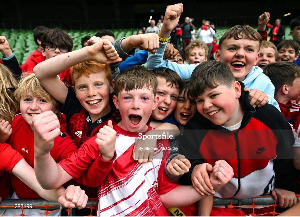 29 May 2024; Seán Connolly of Beaumont BNS, Blackrock, Cork, celebrates with supporters after his side won the A cup, for mixed small sized schools, during the FAI Primary 5s Finals day at Aviva Stadium in Dublin. Photo by Stephen McCarthy/Sportsfile