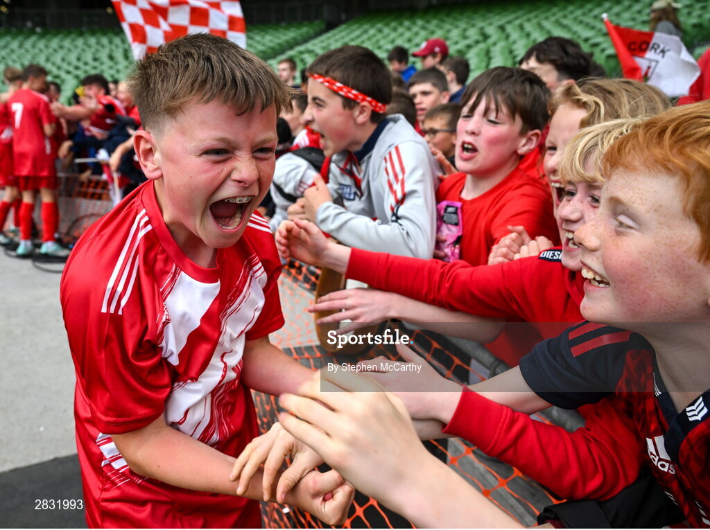 29 May 2024; Conor Browne of Beaumont BNS, Blackrock, Cork, celebrates with supporters after his side won the A cup, for mixed small sized schools, during the FAI Primary 5s Finals day at Aviva Stadium in Dublin. Photo by Stephen McCarthy/Sportsfile