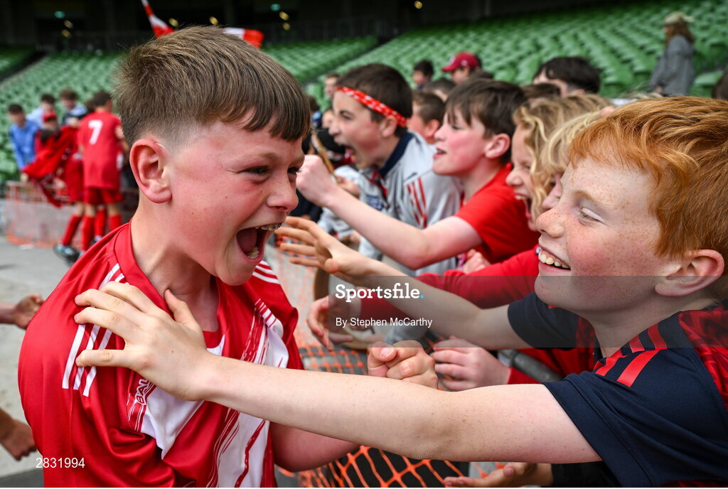 29 May 2024; Conor Browne of Beaumont BNS, Blackrock, Cork, celebrates with supporters after his side won the A cup, for mixed small sized schools, during the FAI Primary 5s Finals day at Aviva Stadium in Dublin. Photo by Stephen McCarthy/Sportsfile