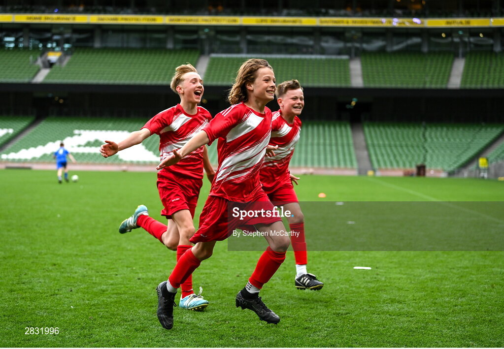 29 May 2024; Fionn O’Leary and his Beaumont BNS, Blackrock, Cork, team-mates celebrates after winning the A cup, for mixed small sized schools, during the FAI Primary 5s Finals day at Aviva Stadium in Dublin. Photo by Stephen McCarthy/Sportsfile